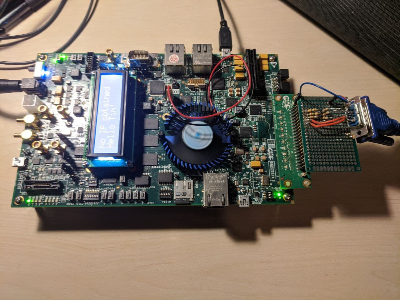 The development board hooked up to power, a PC and a VGA display.